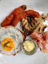 Hot Breakfast Plate with Sausage, Fried Egg , Bacon, Mushroom and Sweet Brioche Bread / English Style