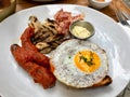 Hot Breakfast Plate with Sausage, Fried Egg , Bacon, Mushroom and Sweet Brioche Bread / English Style