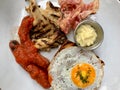 Hot Breakfast Plate with Sausage, Fried Egg , Bacon, Mushroom and Sweet Brioche Bread / English Style