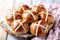 Hot buns, freshly baked hot buns on a wooden plate. Traditional Easter food