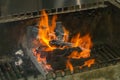 Hot burning flame on charcoal in barbecue grilling stove Royalty Free Stock Photo