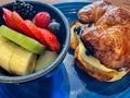 Delicious fruit salad with blueberry croissant