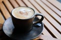 Hot cappuccino latte mocha coffee on wood table Royalty Free Stock Photo