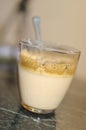 Hot cappucinno caffee foam into glass