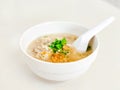 Hot chicken boiled rice soup in a white ceramic bowl. Delicious Chinese food Royalty Free Stock Photo