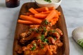 Hot Chicken Wings on wood plate Royalty Free Stock Photo