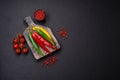 Hot chili peppers of three different colors red, green and yellow Royalty Free Stock Photo