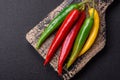 Hot chili peppers of three different colors red, green and yellow Royalty Free Stock Photo