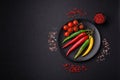 Hot chili peppers of three different colors red, green and yellow Royalty Free Stock Photo