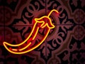 Hot chilli shaped neon sign in bright orange colours glow in the dark