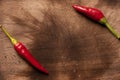 Hot chilli Thai cayenne peppers on wooden board with space for text Royalty Free Stock Photo