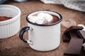 Hot chocolat with marshmallows on a rustic wooden table