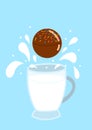 hot chocolate bomb with milk splash on a blue background and with a mug of milk