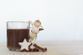 Hot chocolate with christmas angel and star-shaped cookies. White background with copy space Royalty Free Stock Photo