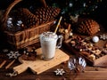 Hot chocolate drink with whipped cream. Cozy Christmas composition on a dark wooden background. Sweet treats for cold Royalty Free Stock Photo