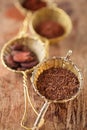 hot chocolate flakes with chilli flavor in old rustic style silver sieve Royalty Free Stock Photo