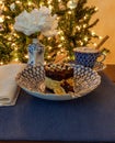 Hot chocolate and layered dark and white chocolate dessert on a fancy bone China