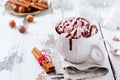 Hot chocolate with marshmallow candies in white rustic ceramic cup on old light vintage wooden background. Selective focus Royalty Free Stock Photo