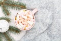 Hot chocolate with marshmallows in a pink cup. Cozy holiday concept