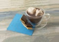 Hot chocolate with melting marshmallows and chocolate snack