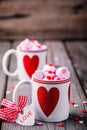 Hot chocolate with pink marshmallow in mugs with hearts for Valentine day Royalty Free Stock Photo