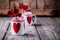 Hot chocolate with pink marshmallow in mugs with hearts for Valentine day Royalty Free Stock Photo