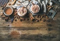 Hot chocolate with whipped cream, nuts, spices and cocoa powder Royalty Free Stock Photo