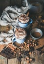 Hot chocolate with whipped cream, nuts, spices, cocoa powder Royalty Free Stock Photo