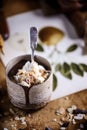 Hot chocolate with whipped cream and toasted almonds in a ceramic glass