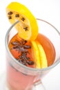 Hot citrus drink with alcohol and orange slices and spices, winter drink, product photography for restaurant or cafe