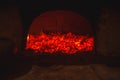 Hot coal in a Russian stove in the dark burning with red fire Royalty Free Stock Photo