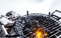 Hot coals in a BBQ outdoors in winter
