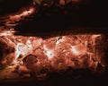 Hot coals burning out in the fireplace closeup Royalty Free Stock Photo