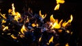 Hot coals in the fire.actively smoldering embers of fire.Burning firewood in the fireplace close up, BBQ fire.black Royalty Free Stock Photo