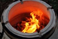 hot coals and fire in handmade clay tandoor close-up