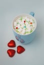 Hot Coccoa or Chocolate with Marshmallows Red Heart Shape Chocolate on Blue Background. Toned. Hot Drinks Concept. Soft Royalty Free Stock Photo