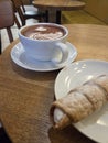 Hot Cocoa with Cannoli in Cozy Cafe Royalty Free Stock Photo