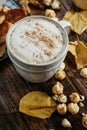 Hot cocoa coffee with popcorn, apple, cakes, leaves on the old Royalty Free Stock Photo