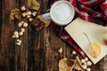 Hot cocoa coffee with popcorn, apple, cakes, leaves on the old Royalty Free Stock Photo