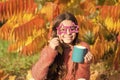 Hot cocoa. Little child hold cup energy drink. Small girl recharge energy with hot drink sunny autumn day. Fall is Royalty Free Stock Photo