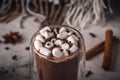 Hot cocoa with marshmallow and chocolate chips on a background of scattered cloves, chocolate, star anise and cinnamon, with a Royalty Free Stock Photo