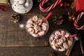 Hot cocoa with marshmallows in a glass cup on a brown wooden background. top view Winter. new Year. Christmas. tree gifts Royalty Free Stock Photo