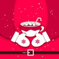 Hot Cocoa with Marshmallows on Santa hugs. Christmas Coffee mug with Hot Drink Chocolate. Cup on red. Warm wishes. Happy