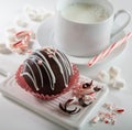 Hot cocoa peppermint bomb with cup in background Royalty Free Stock Photo