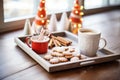 hot cocoa on tray with sugar dusted donuts