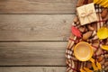 Hot coffee and autumn leaves on grey wooden background - seasonal relax concept