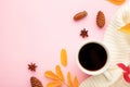 Hot coffee and autumn leaves on pink - seasonal relax concept