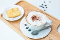 Hot coffee on background served with cream crackers on white plate