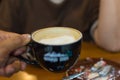 Hot Coffee in black cup Royalty Free Stock Photo