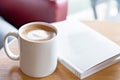 Hot coffee with book on table. Take a break concept. Royalty Free Stock Photo